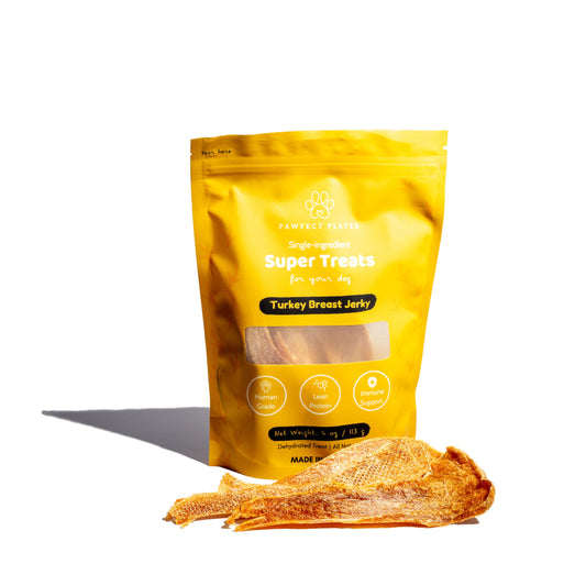 Turkey Breast Jerky for dogs packaged with treats in front of package